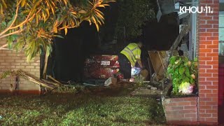 Raw video: Car crashes into two homes in southwest Houston