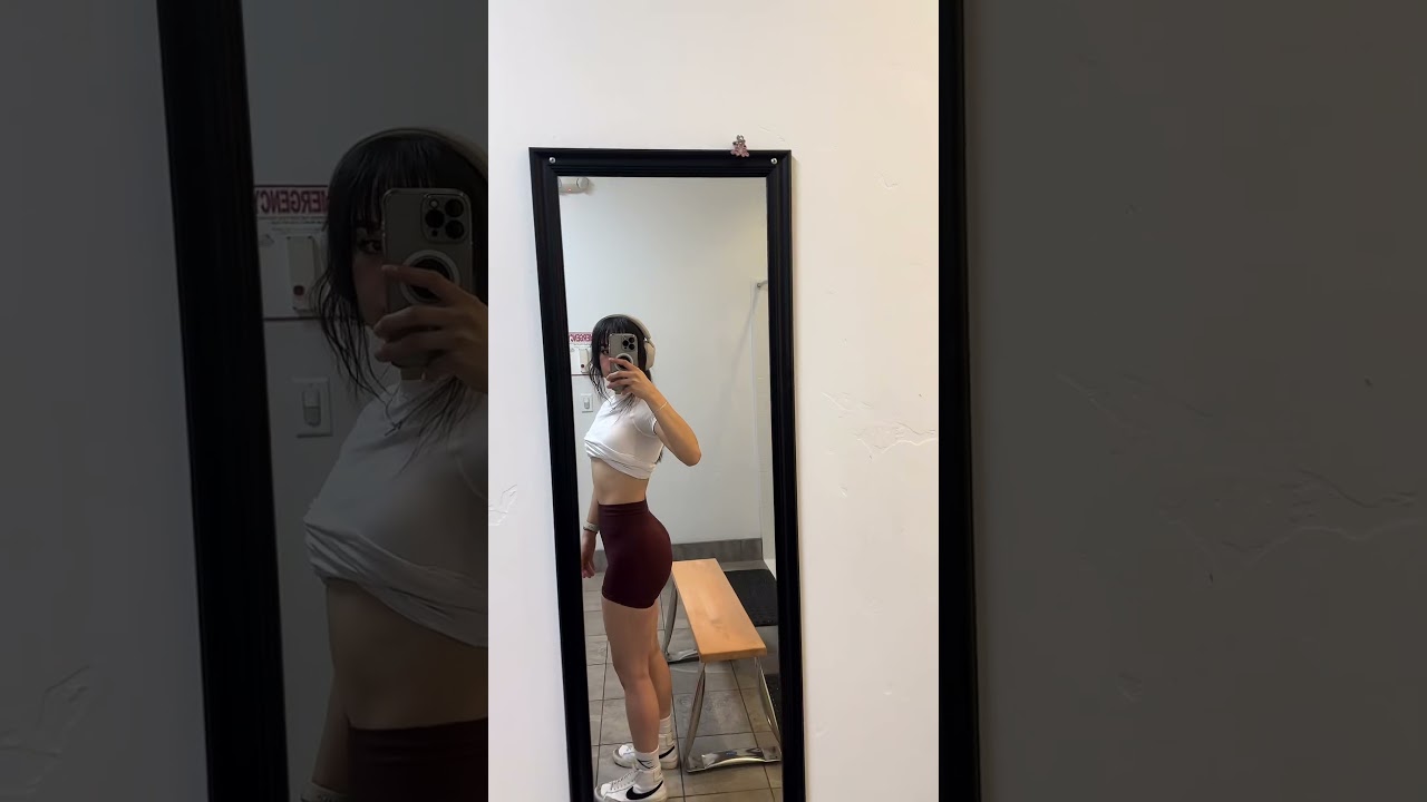 Brunette in Sporty Outfit Strikes a Pose