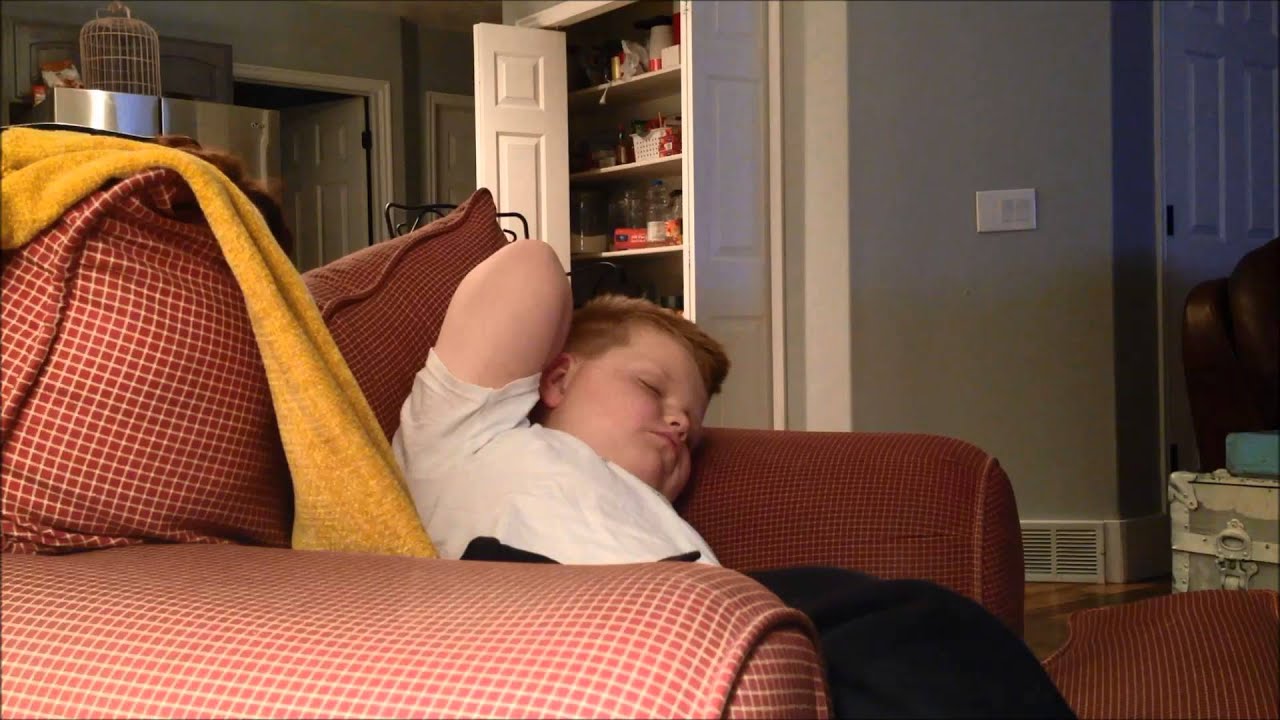 Mom Tickles her sleeping kids nose