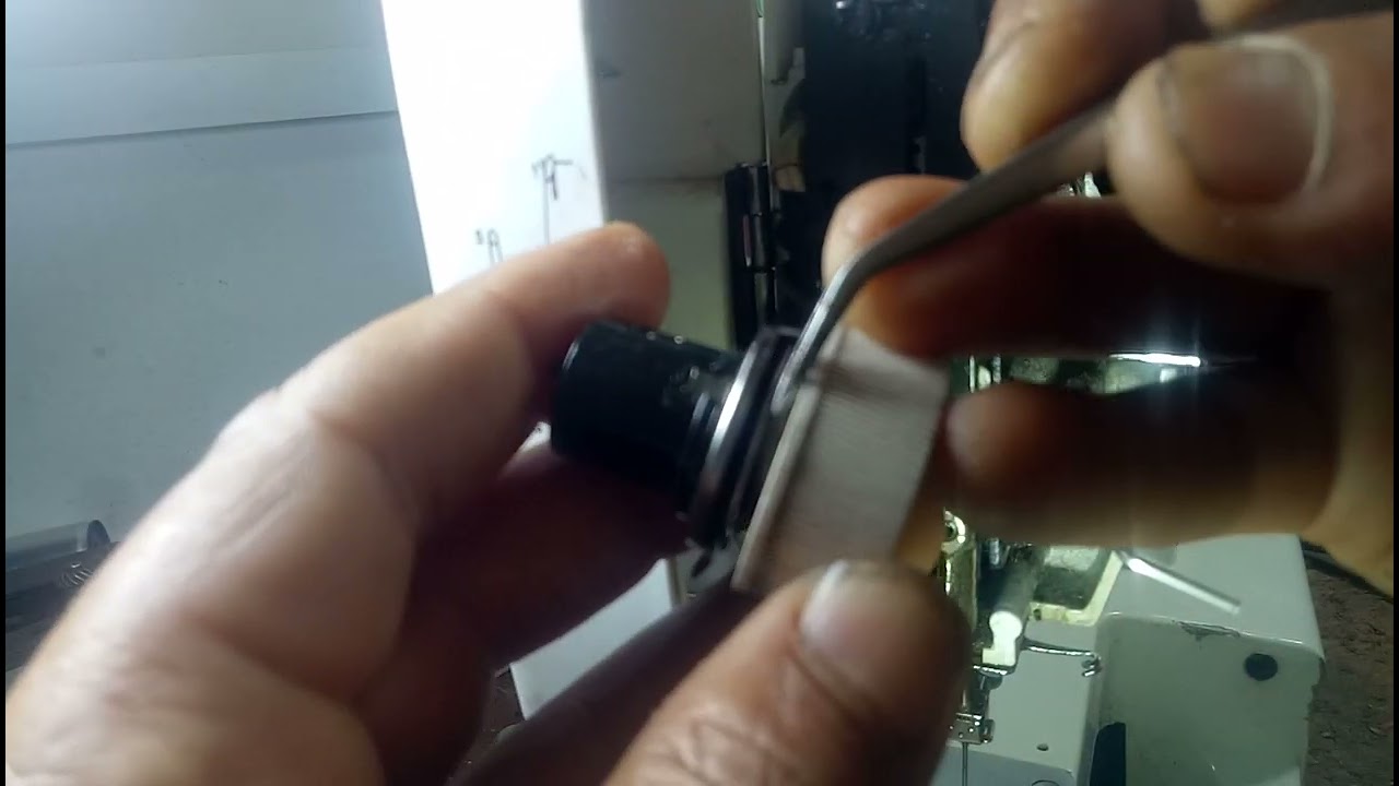 super zig zag'878'comment réparer '''' tension