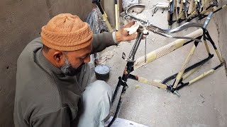 Street Guy Assembling Sohrab Bicycle
