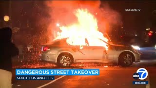 Fire engulfs car during wild street takeover in Los Angeles