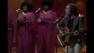 LOVES ME LIKE A ROCK by Paul Simon & The Jesse Dixon Singers
