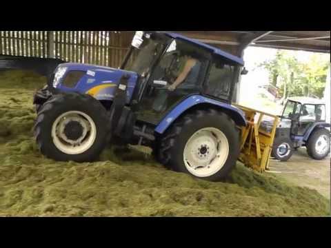 Back up the hill to the farm where the lads are busy with the grass. Rolling with the classic Ford 7740 and spreading with the New Holland. Quick look at som...