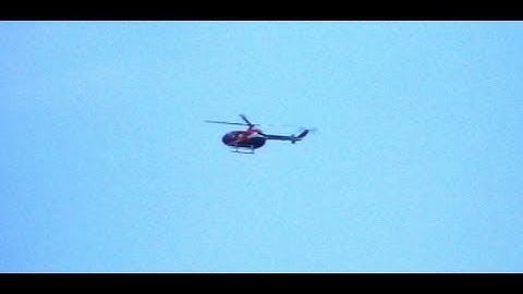 Aerobatic Helicopter Flying Upside Down Loops and Backwards Maneuvers With Precision Skill