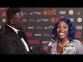 Dancehall artist latoyah bless on the red carpet with eric reverence at the premier gospel awards