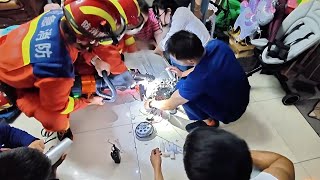 Firefighters cut apart washer to free trapped toddler