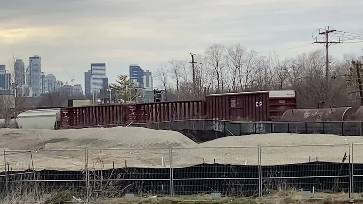 CP and BNSF locomotives hauling freight at Don Mills and Wynford Drive