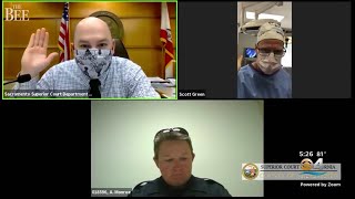Doctor Appears In Traffic Court Video Call While In An Operating Room