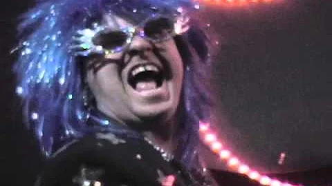 Lee Alverson as Sir Elton John