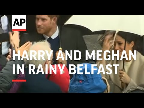 Prince Harry and Meghan Markle do a meet and greet in rainy Belfast