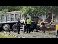Dump truck crashes into Greensboro home, injuring two