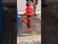 firefighter is opening a fire hydrant by the roadside: #firefighter #hydrant #water #shorts