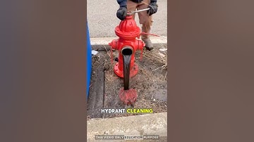firefighter is opening a fire hydrant by the roadside: #firefighter #hydrant #water #shorts