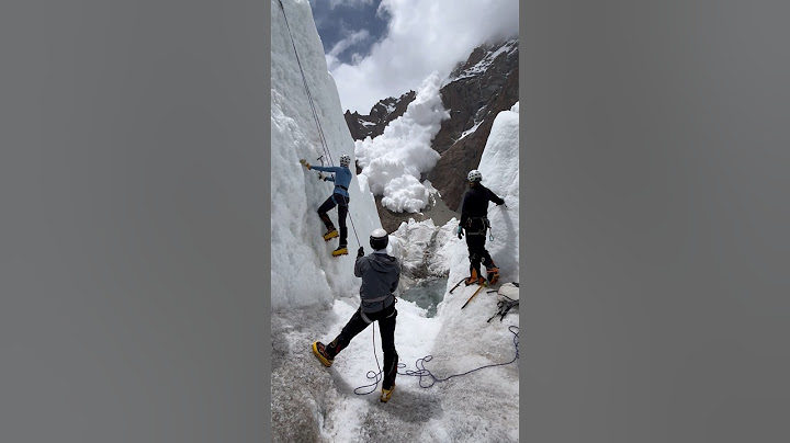 Climbers caught off guard as a massive avalanche crashes down the ice wall #wow #nature #shortsvideo