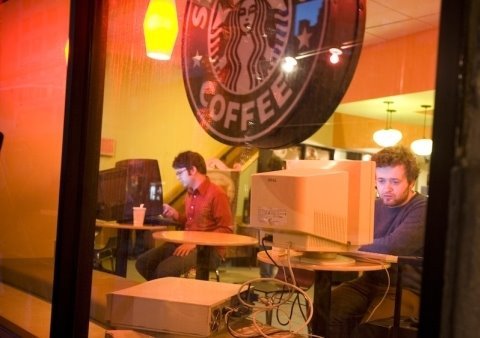 From improveverywhere.com Three agents entered a Starbucks one by one with their own giant desktop computer and CRT monitor rig. They bought coffee and worked at their computers as if they were laptops. One computer even had a Wi-Fi card installed, enabling our agent to surf the web. Produced and Created by Charlie Todd improveverywhere.com Produced and Edited by Matt Adams www.mattadamsapple.com Music by Tyler Walker tylerwalkermusic.com This is one ofover 100 different missions Improv Everywhere has executed since 2001 in New York City. Others include Frozen Grand Central, the Food Court Musical, and the famous No Pants Subway Ride, to name a few. Visit the website to see tons of photos and video of all of our work, including behind the scenes information on how this video was made. http Be the first to find out about the next video we create by subscribing to our YouTube channel: youtube.com Facebook Fan Page: facebook.com Follow us on Twitter: twitter.com Buy the new Improv Everywhere book: www.amazon.com