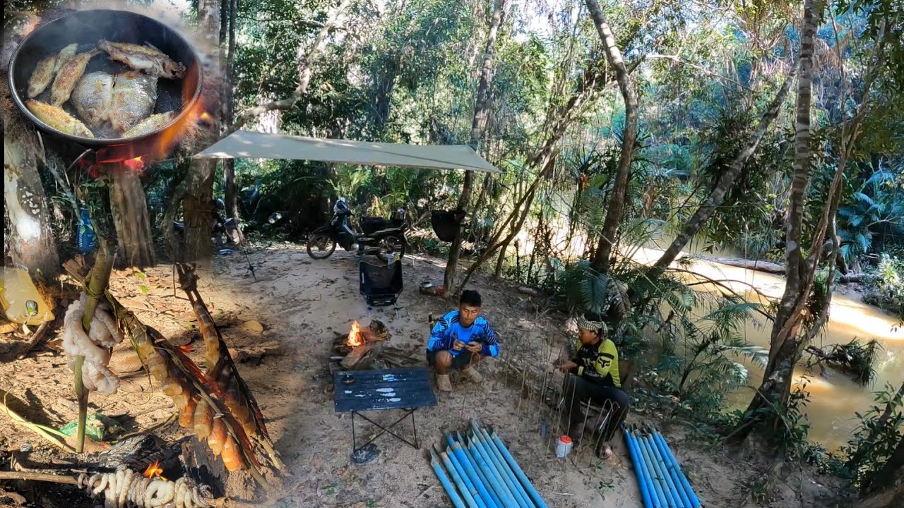 Set up a tent by a stream in Prey Lang to find fish to cook. Grilled squid, shrimp to eat.