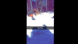 Homemade snowboard ramp with snowmobile