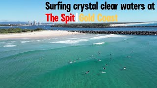 Surfing crystal clear waters at The Spit Gold Coast. #surfing #ocean #goldcoast