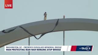 Iran war protester still atop bridge in D.C. after 4 days, says he’ll come down 'soon'