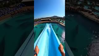 Waterslide Into Pool Full Of Giant Fist