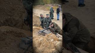 A spectator at a reenactment fires an MG-42 machine gun. Reenactors. #ww2