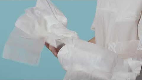 Instructions for how to apply a TENA Slip on a user