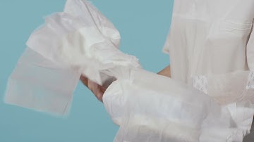 Instructions for how to apply a TENA Slip on a user