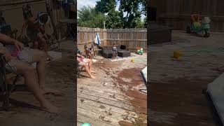 Boy runs on deck and jumps into above ground pool and gets leg stuck underneath white top rail