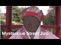 Japanese street jizo surprising buddhist statue in the middle of the street