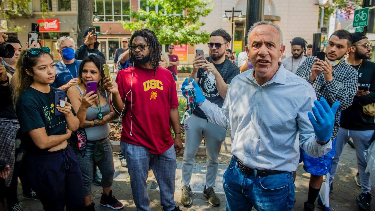 Mayor Steinberg is confronted with community members outraged by response to looting