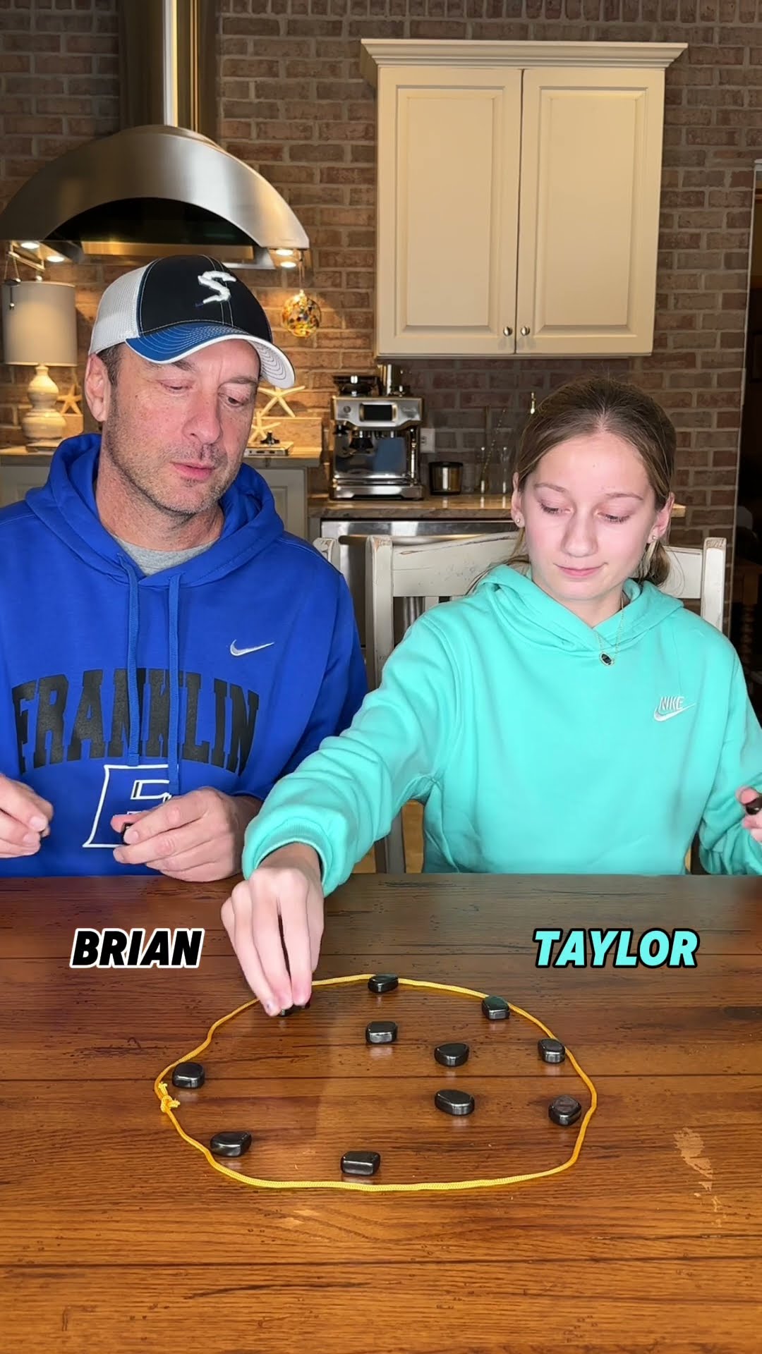 Can the daughter beat her dad in the magnet game??