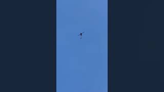 Robinson R44 Clipper II G-ETKT flying over Farnborough Airport