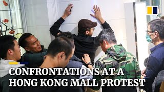 Hong Kong 'Christmas shopping protesters' confronted by police