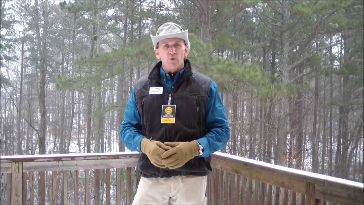 An Alpharetta home inspector explains the consequences of trees overhanging a home and power lines.
