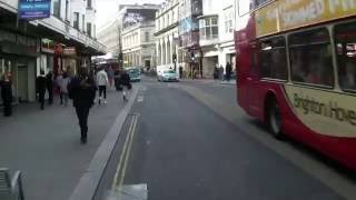 Cyclist red light jump through crossing pedestrians