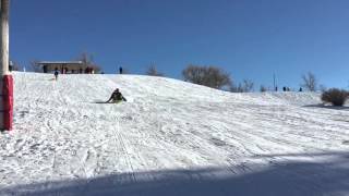 Awesome sledding jump. You are never to old to jump your sled. Coolest dad ever.