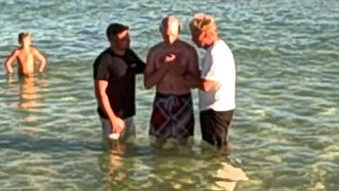Kenny Blankenship being baptised on Navarre Beach ...