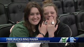 Fans wait in cold, rain to get free Bucks championship ring replicas