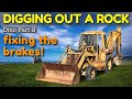 Fixing the Brakes on a Backhoe and Digging a Rock [Dino Part 9]