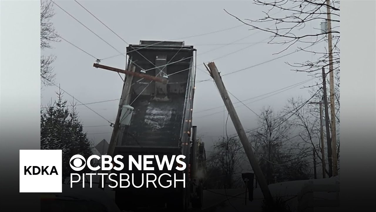 Dump truck bed gets tangled in wires on North Huntingdon road - YouTube