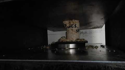 Porous coral limestone rock crumbling in Uniaxial Compression Test