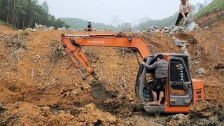 Excavator digs foundation in swamp to build stone wall. Building Life, Episode 224