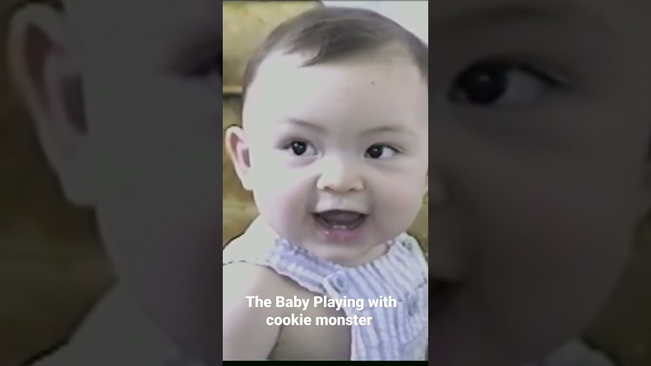 The Baby Playing with a cookie monster Vid
