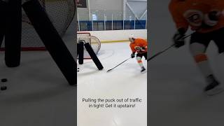 Working with Travis Konecny on pulling the puck out of traffic in tight and getting it upstairs!