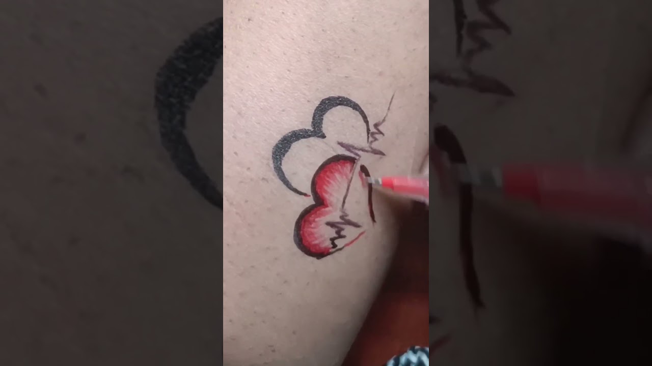 heart tattoo with pen 