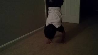 Ty straddle bridge handstand to a forward roll and stick