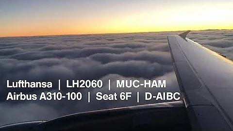 Early Morning Take-off into the winter sunrise from Munich Airport in a Lufthansa Airbus A319
