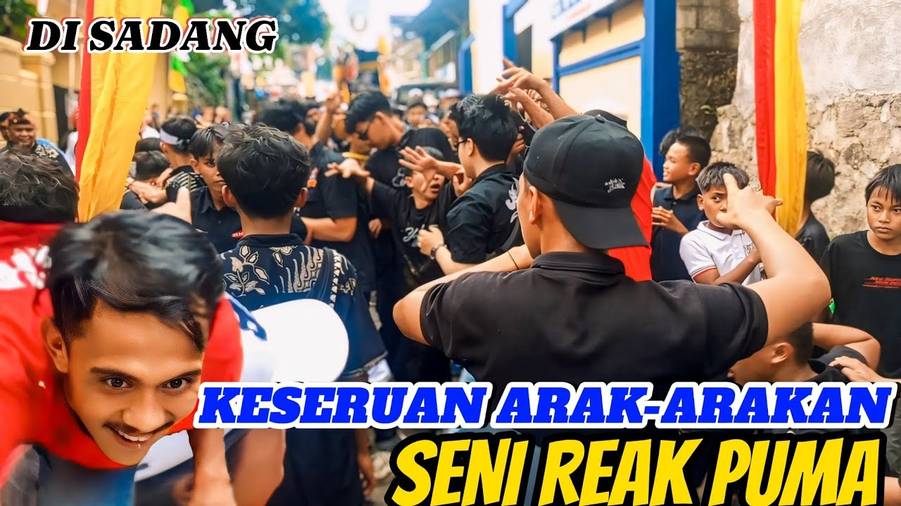 KESERUAN ARAK-ARAKAN SENI REAK PUMA DI SADANG 