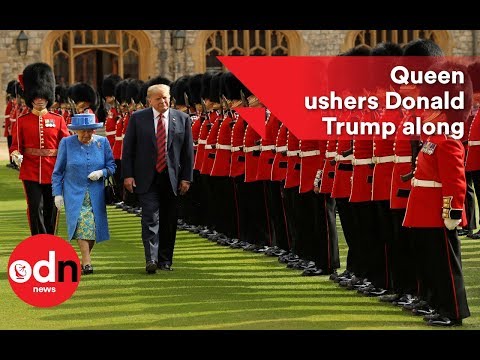 Queen ushers Donald Trump along as he inspects Guards